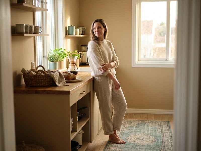 what to cut from your budget — Her Own Compass, woman feeling confident about her household budget